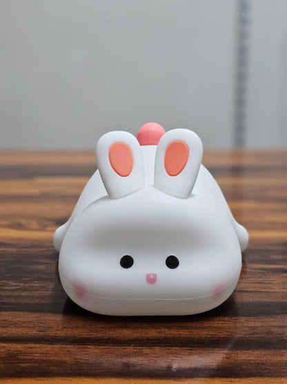 Big Face Rabbit Silicone Night Lamp on a wooden table turned off
